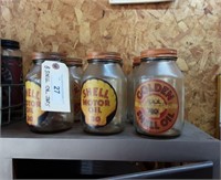 (8) Shell Motor oil jars with lids.