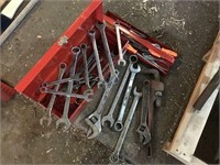 Red tool box with complete set of wrenches plus