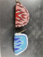 A pair of intricately beaded coin purses in Native