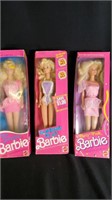 3 Barbies ( in original packaging)