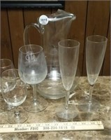 Glass pitcher and wine and champagne glasses