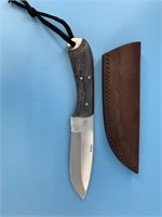 Knife with a wood handle, 9" long with engraved le