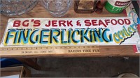 Vintage fingerlicking seafood center sign
