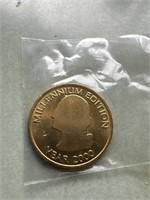 Gold tone millennium edition coin