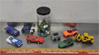 Diecast toy vehicles, marbles in jar