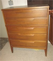 Five drawer wood dresser. Measures 43" h x 34" w
