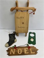 Wooden decor with happy holidays sleigh