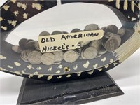 Looney bin half full of old American nickels