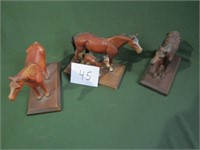 4 Cast Iron Horses mounted on wood - org paint