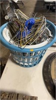 Three clothes baskets with metal hangers