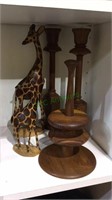 Two carved wood giraffes, 2 wood candlesticks,