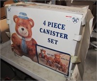 Four piece bear canister set in box.