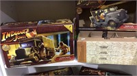 Two Indian Jones movie toy cars, in the boxes,