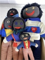 Group of five black americana folk art dolls