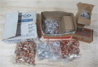 Assorted copper fittings and plumbing items.