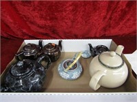 Box of teapots.