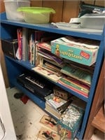 Bookshelf full of children’s books and few toys