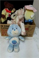 Box of stuffed animal including vintage care bear