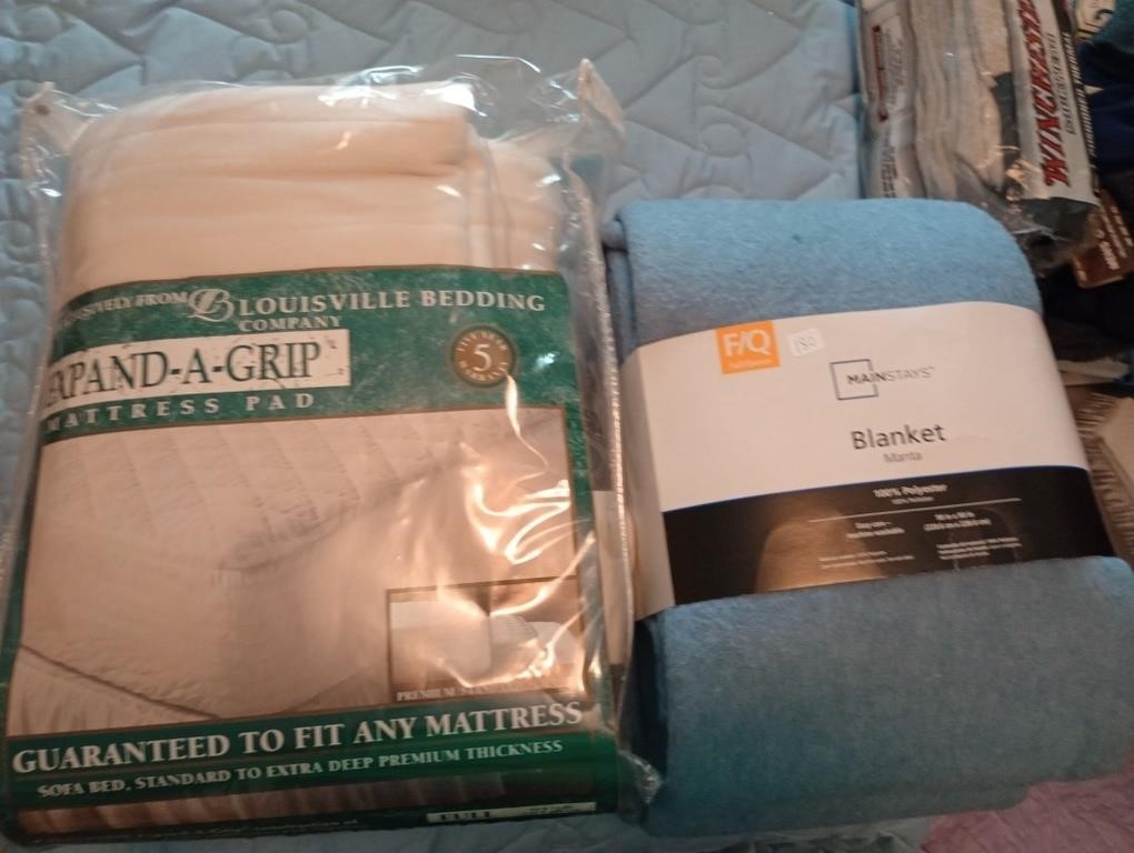 New in pkg full size poly blanket and mattress pad