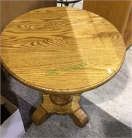 Small round top oak side table by heirloom