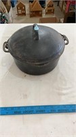 Cast iron cooking pot.