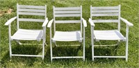 5 white folding chairs, slat backs and seats