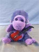 Stuffed guitar ape-gorilla. Doesn't work. May