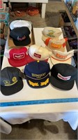 Various hats unknown sizes.