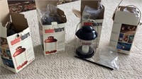 C2) Four Weber lanterns. Can be hung or posted in