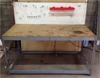 Metal work bench with tool peg board & electric.