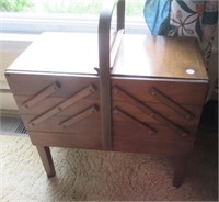 Antique wood sewing cabinet with thread and