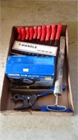 Tray of Allen keys, leather puncher, drill pump