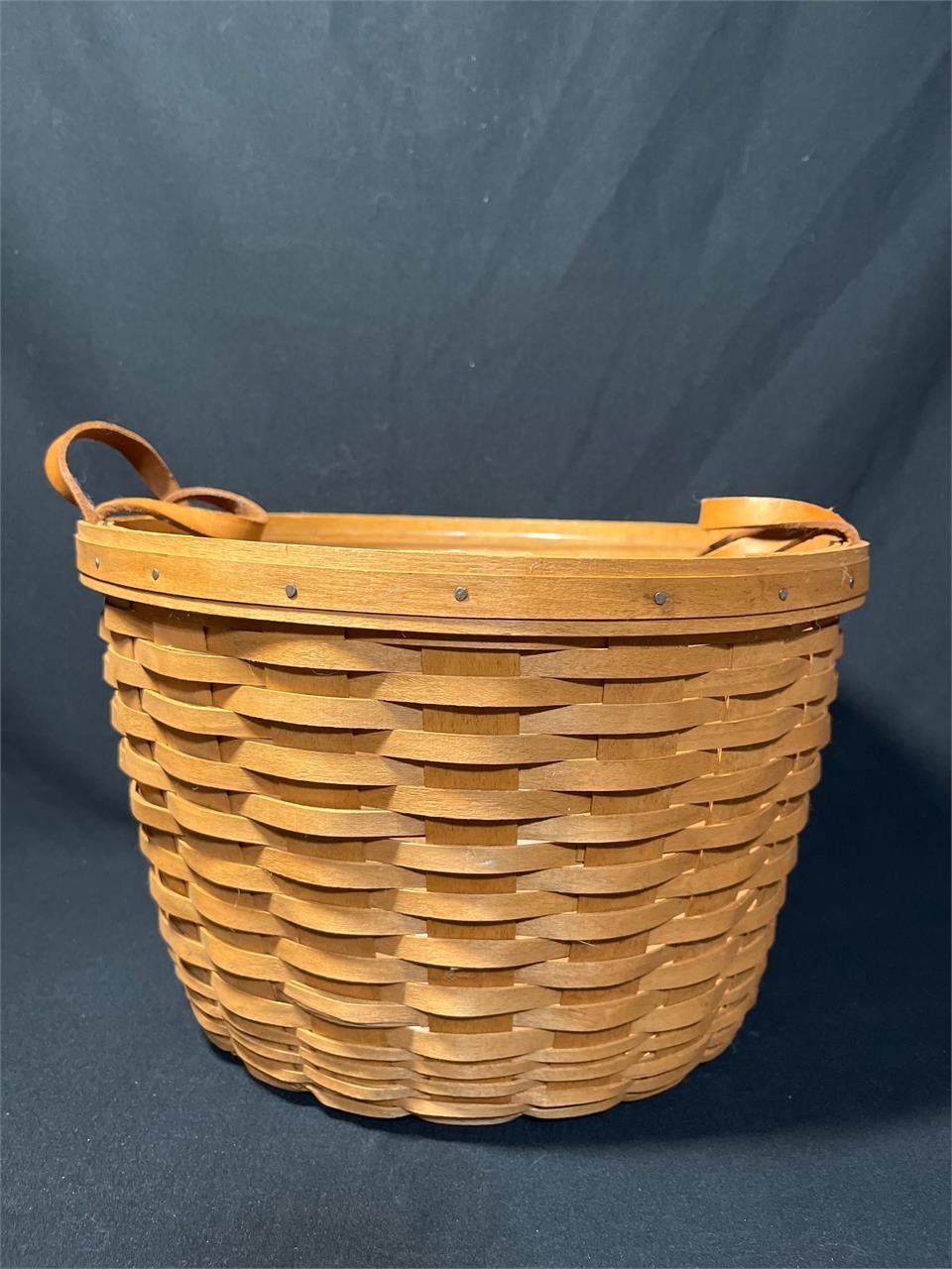 Longaberger round Basket with leather handles.