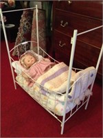 Vintage doll and metal poster bed