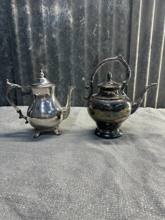 2 feaux silver teapots