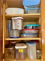 Assorted food storage containers in cabinet