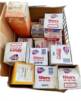 Box of assorted filters, mostly oil & fuel to