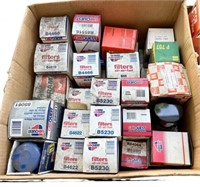 Box of assorted filters, mostly oil & fuel to