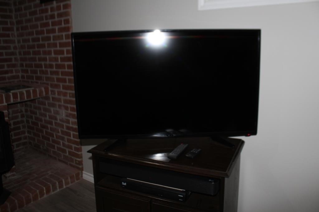 Fluid 42" television with LG sound bar, both with