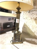 Brass colored lamp with shade