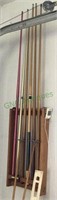 Great lot of six pool sticks and two guides also