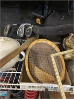 assorted sports supplies including racket bat and