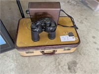 binoculars and suite case