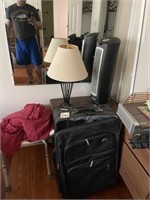 Suitcases, lamp, fan, table