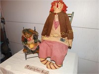 Two wooden doll chairs one with Raggedy Ann, one