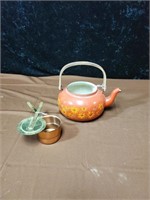 Orange teapot and copper pot