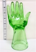 Green glass jewelry hand
