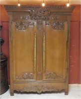 French Normandy Grape Cluster Carved Oak Armoire.
