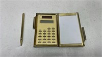 Calculator in case with pen and pen pad