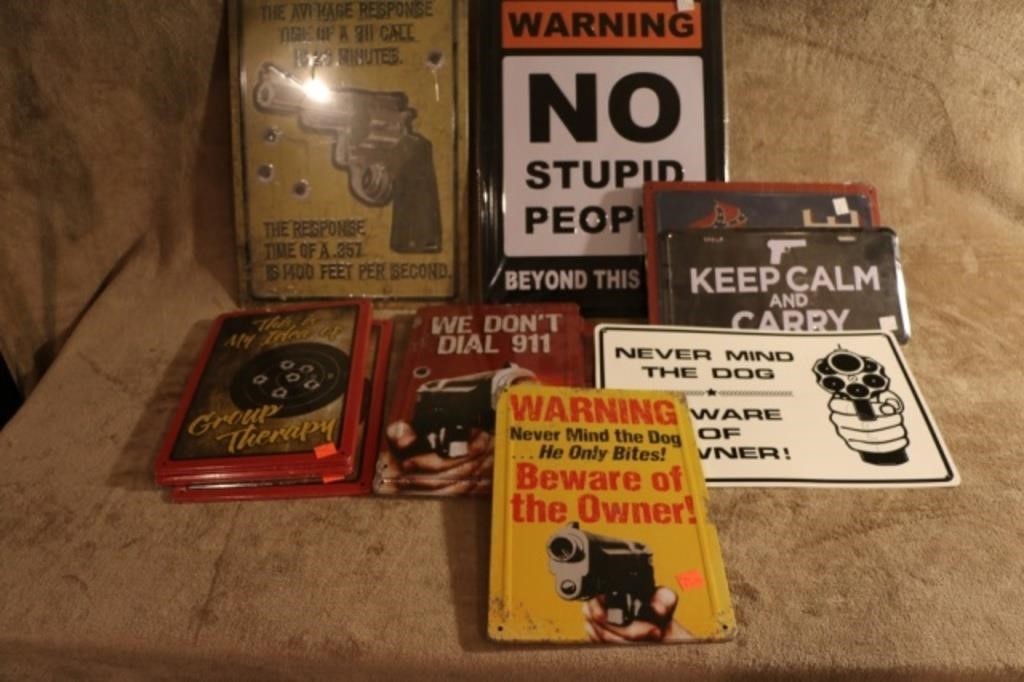 Lot of assorted gun related metal signs